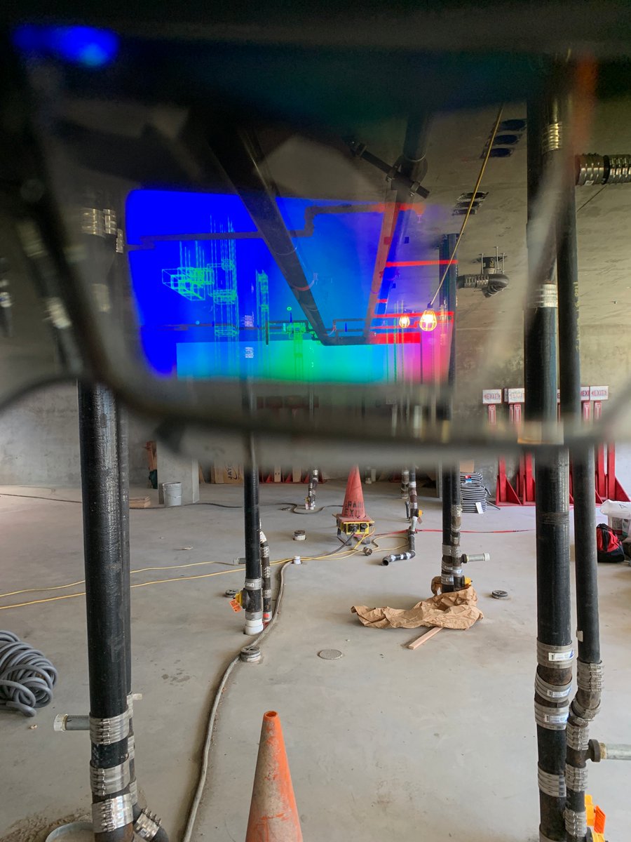pankowVDC's tweet photo. Luis and Vinh testing the HoloLens with @Trimble Connect at #CityGardens. Using augmented reality (AR) to compare the coordinated model with fire sprinkler and plumbing work. Exciting potential for future use with quality control/scope completion. #AR #RnD @pankowbuilders https://t.co/puQ1UzondX