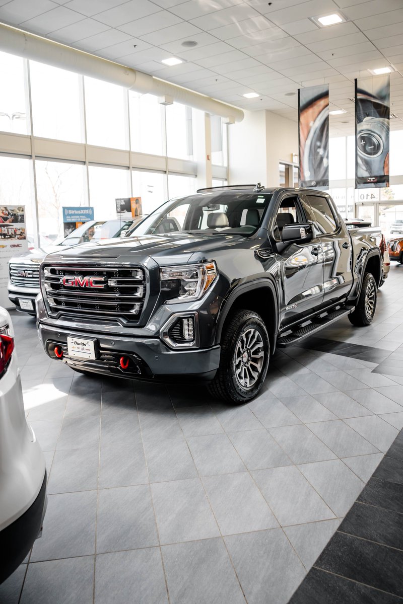 Buddschev's tweet photo. This brand new 2019 GMC Sierra AT4 is a stunning colour called “Dark Sky Metallic”. This is a dark grey that becomes a gorgeous metallic in the light as seen in the second photo. Come see this truck for yourself at Budds Chevrolet! #BuddsChev #OakvilleTruckCentre https://t.co/xyWFOUBcbD