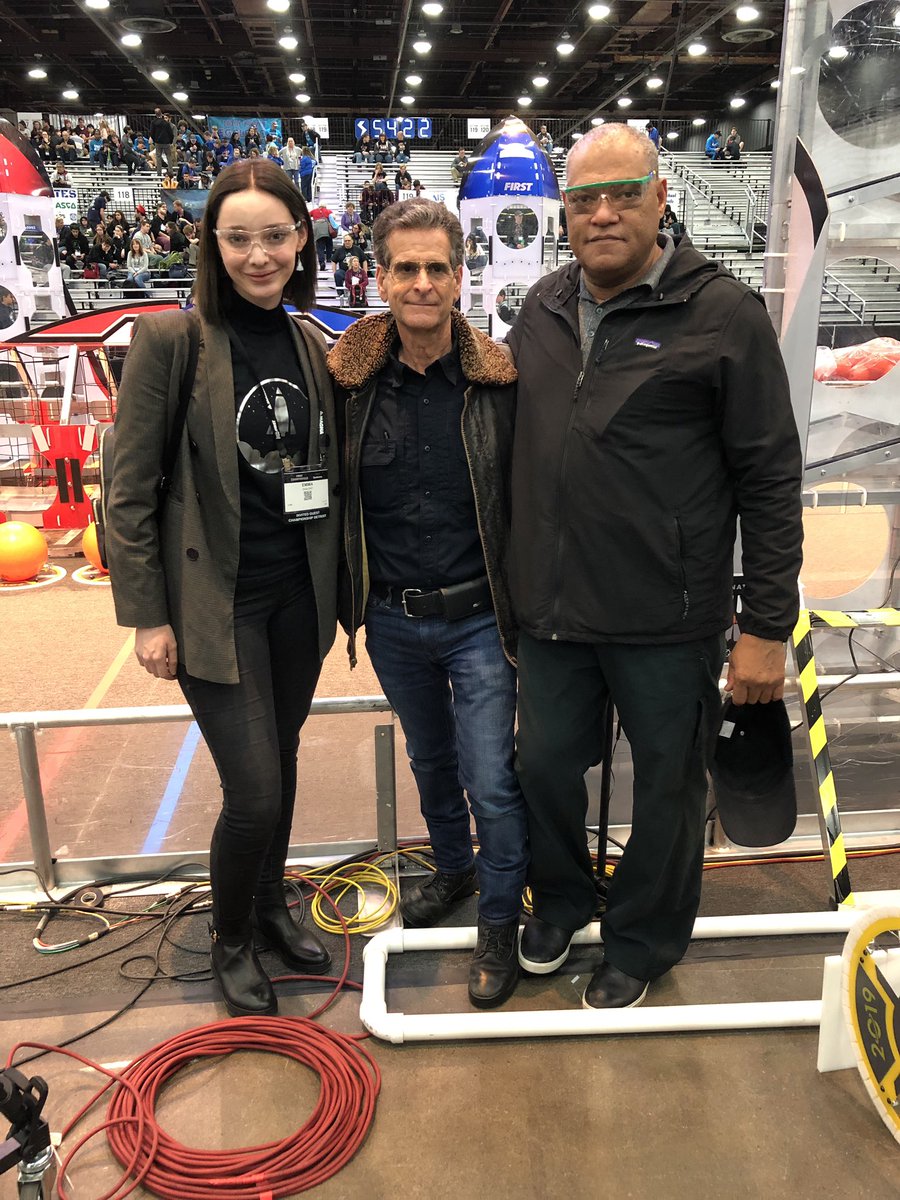 Look who’s here to #makeitloud! 👀 <a href="/EmmaDumont/">Emma Dumont</a>, Dean Kamen, and Laurence Fishburne checking out the <a href="/FRCTeams/">FIRST Robotics Competition</a> fields. #FIRSTChamp