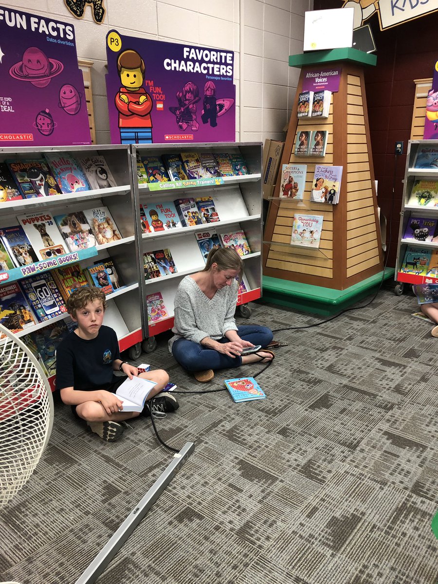 HFE students and families purchase AND read books during National Library Week/Book Fair
