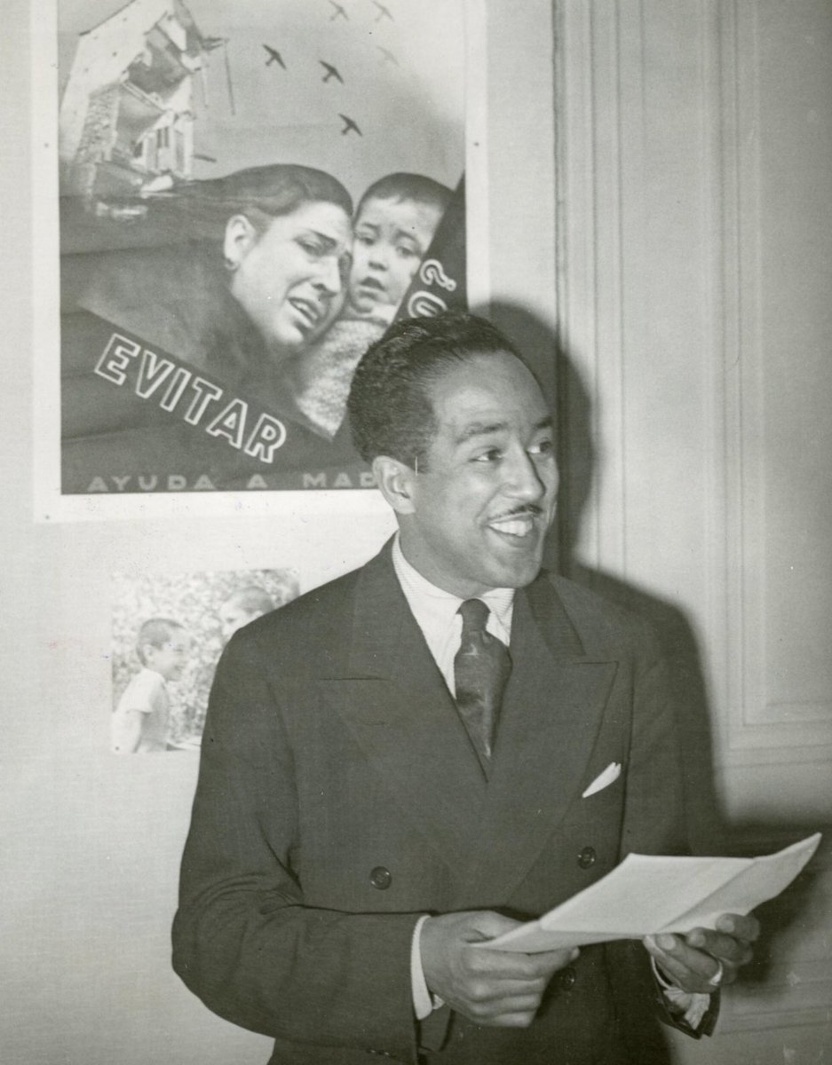 Langston Hughes, American Poet, speaking and reciting poetry before the press and the United Nations "Comite De Coordination" in Paris, France after Spending 4 Months in Spain and Observing the Battle of Teruel, Spain (Communists Vs Government of Spain Aided by Germany). (1938)