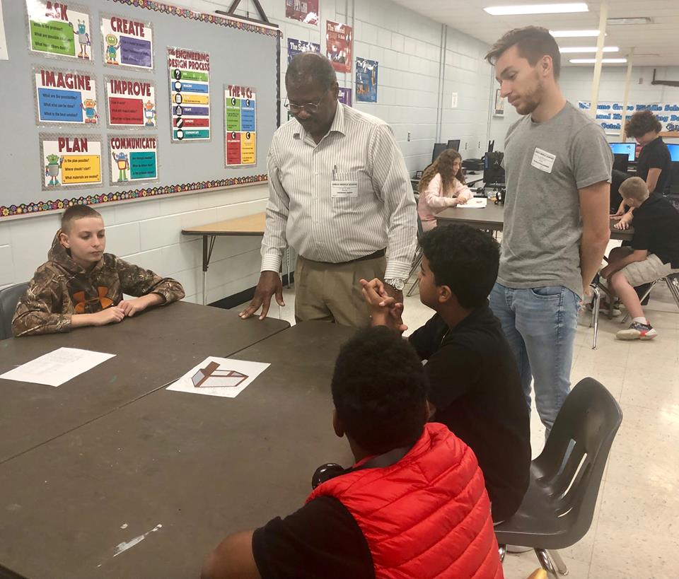 TBFarm2School's tweet photo. What a blast today reviewing 7th grade Greco STEM compost designs with Dr. Trent Green and USF School of Architecture students Tyler Dobson and Ana Cheng! Thank you  Mr. Lewis, Principal Olson and Dr. Russ for supporting this project. @GrecoSTEM @Grecoms #STEMeducation https://t.co/NpAm46ONIa