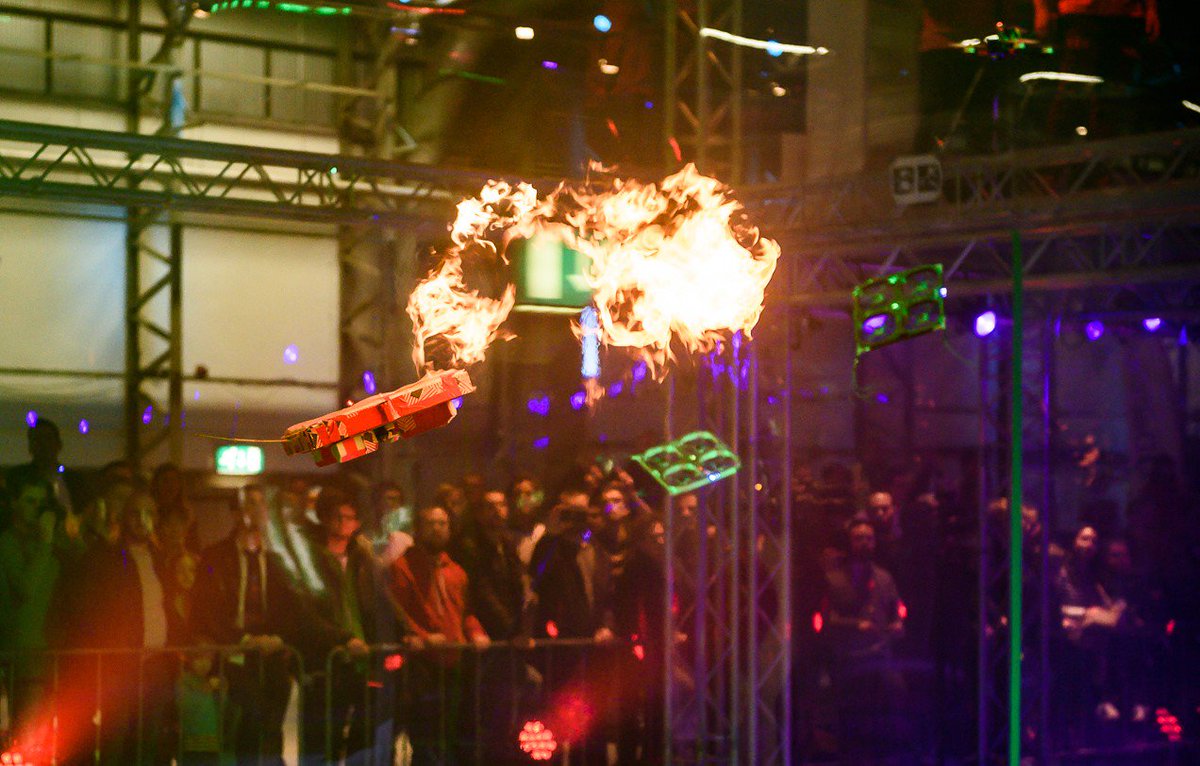 droneclash's tweet photo. So exciting! Drones chasing eachother dancing around the fire. One mistake and you get burned.⁣ https://t.co/40vXvFSzUx