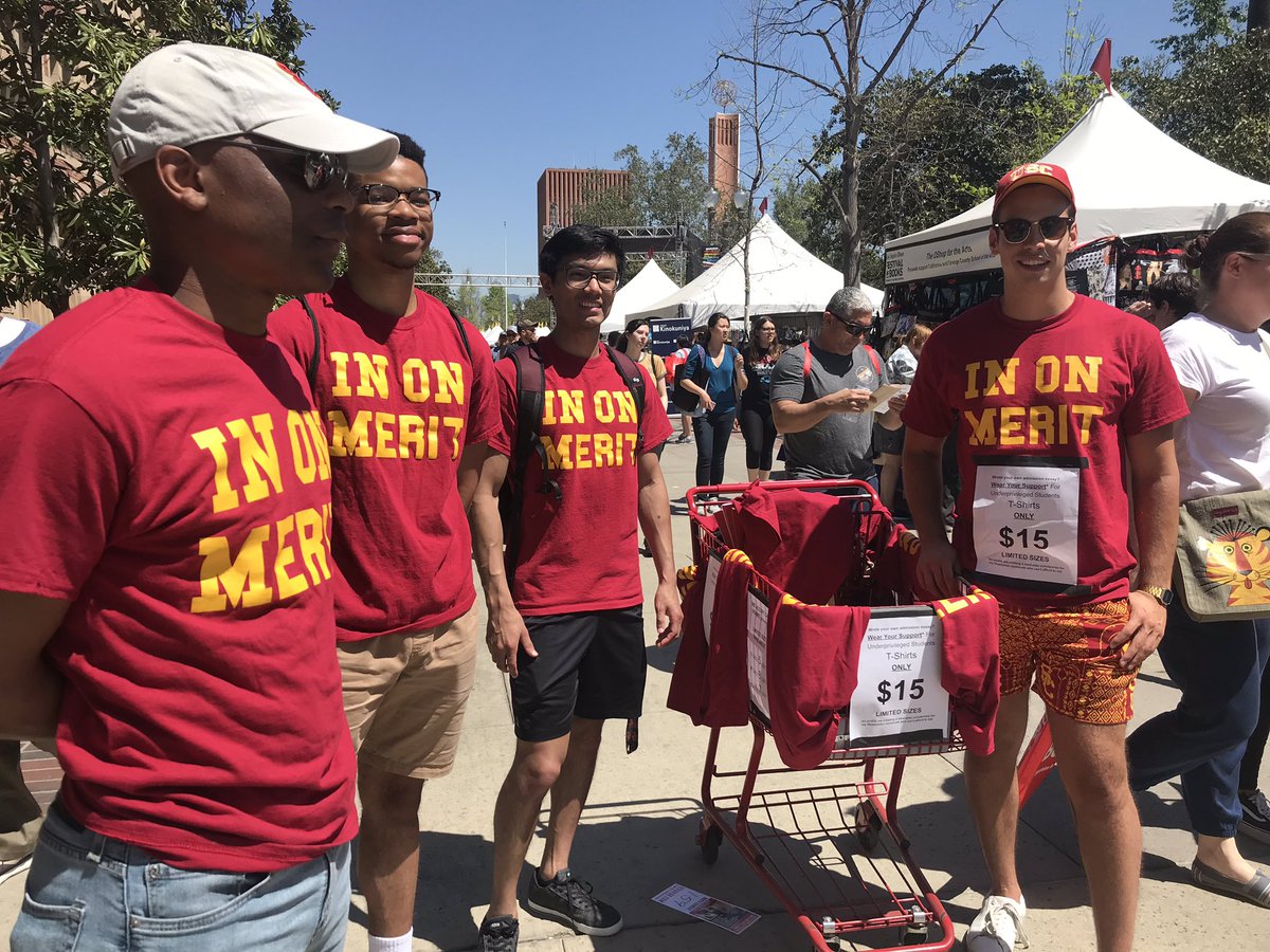 Breaking news at the #LATFOB #USC students selling t-shirts “In On Merit.”