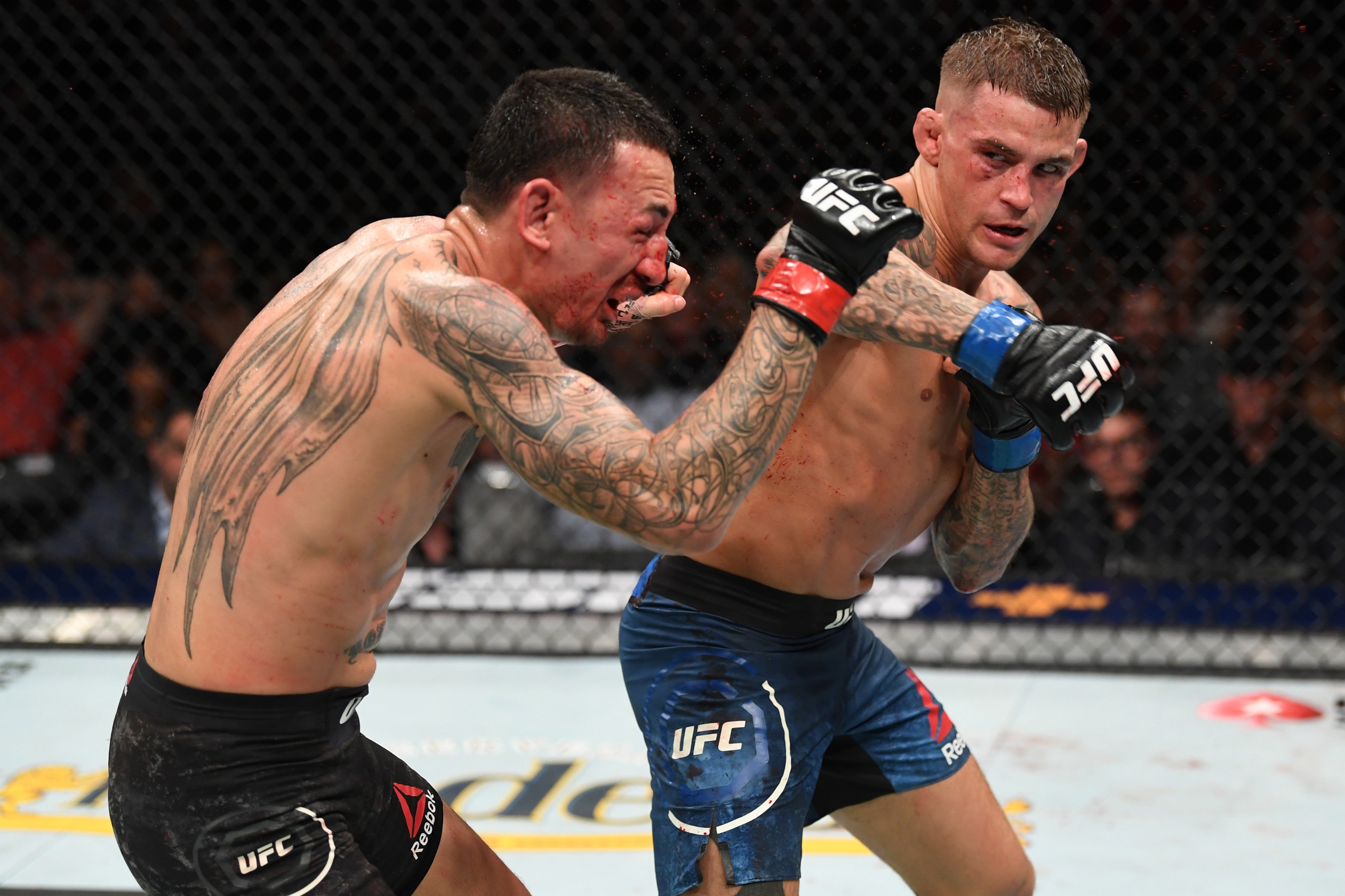 Dustin Poirier hurts Max Holloway during their phenomenal contest at UFC 236 (UFC/Getty Images)