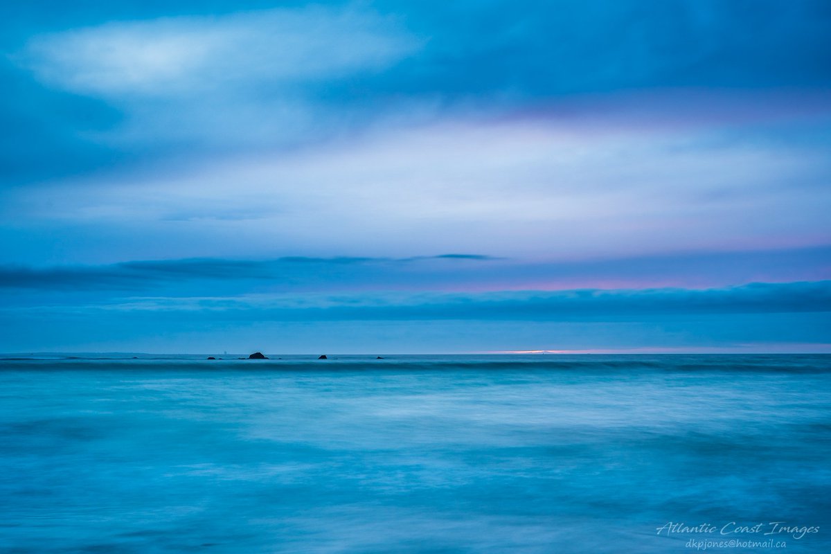 ImagesCoast's tweet photo. Long exposure seascape landscape with Baccarro and the radar station in the background. March 2019 #atlanticcanada #beach #coldbeach #bluehour #wonderfulsky https://t.co/Nkza8x3chf