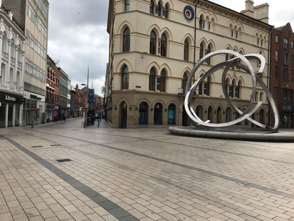 JakeOKane's tweet photo. Bustling Belfast of a Sunday morning. Tourists huddled in closed shop doorways.  Belfast council need to wise up, open this City. https://t.co/b9MCS9weV0