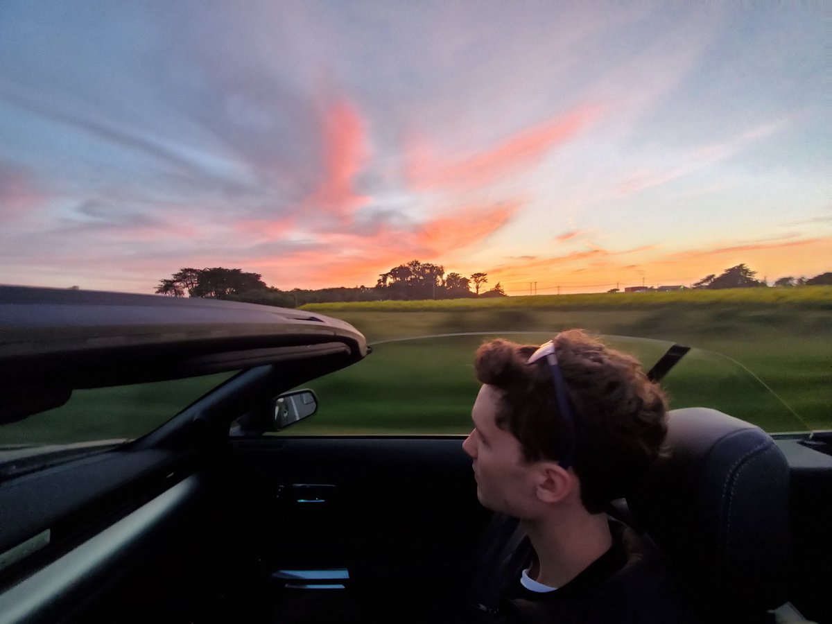 Casey's tweet photo. 🎈today's Owen's 21st birthday!!!!🎈 father/son road trip in a rented convertible to celebrate. (hard to think 21 years ago teenage me was in a hospital looking down at this tiny human.. and now this) https://t.co/QvigXWtAWT