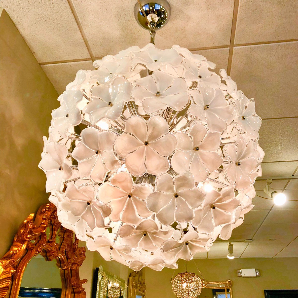 Each cream and white #flower petal is blown by hand by our talented artisans in Murano, Italy. #italy #interiordesign #design