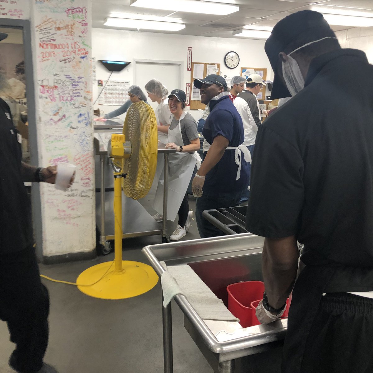 scott_brawley's tweet photo. @DCDeacs @WFUAlumni one last day of #ProHumanitateDays prepping food for @dcck to deliver to homeless and hungry in DC #GoodWearsBlack https://t.co/58px8E9OJM
