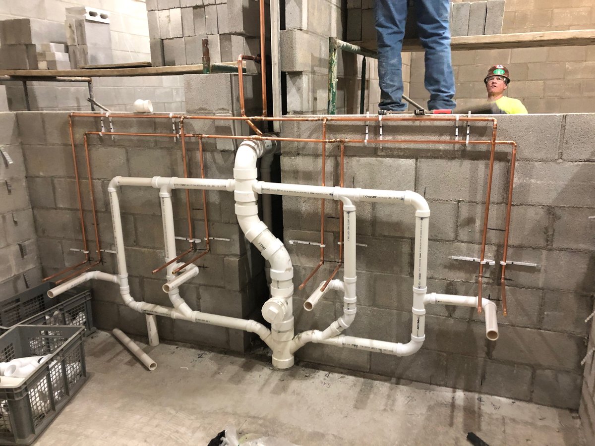 The Action Team hard at work getting everything in place! #plumbing #team #Hardwork