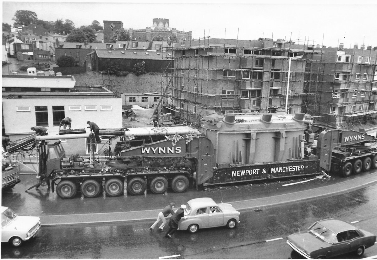 I've recently written an article for <a href="/HeavyTorque/">HeavyTorque Magazine</a> about the air cushion equipment used by heavy hauliers to reduce the axle weight on weak bridges. There's so much going on in this photo, including the police escort pushing a broken down car! <a href="/CCCuration/">Classic Car Curation</a> #heavyhaulage