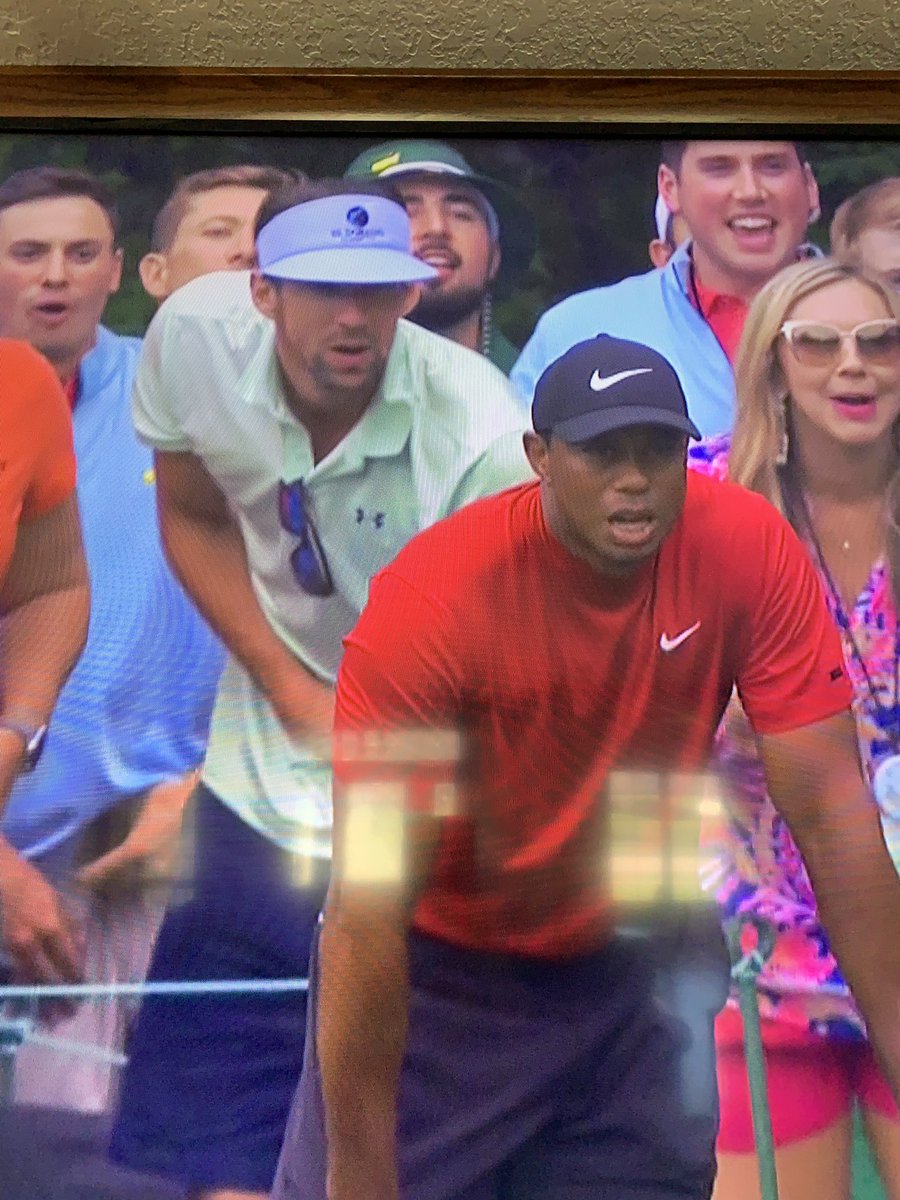 IronHawkeye's tweet photo. Very cool to see the greatest swimmer of all time cheering on the greatest golfer of all time during the greatest comeback of all time. https://t.co/IEr8XNU2Sq