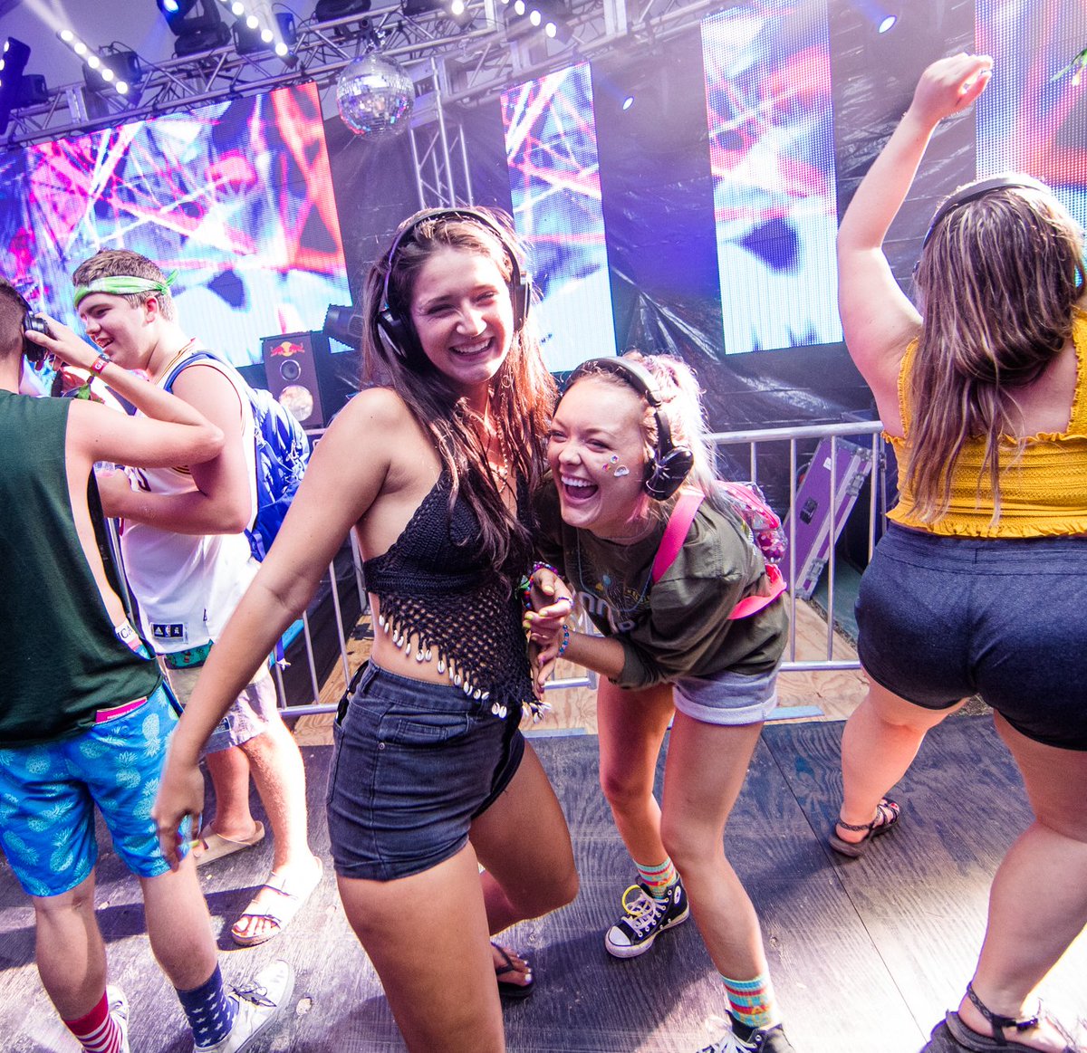 Bonnaroo's tweet photo. The Bonnaroo Silent Disco 🕺💃- the best dance party in this whole damn world.🌎 What are your FAVORITE ridiculous silent disco stories?  
(photo by Joshua Brasted) https://t.co/wBO9buhQ89