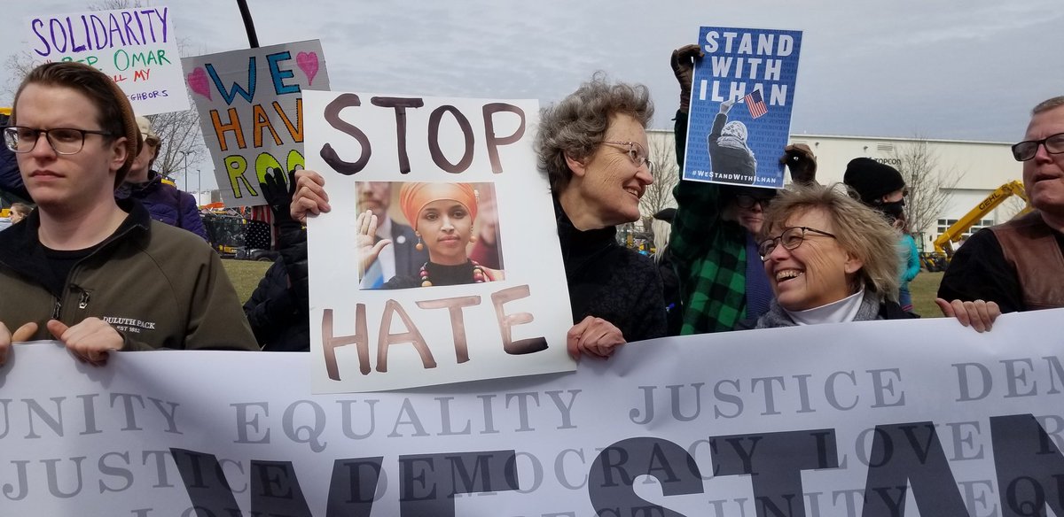 MinnesotaRadio's tweet photo. Rep Omar supporters at Trump Burnsville stop #IStandWithIlan #trump https://t.co/hGfBMvh8u7