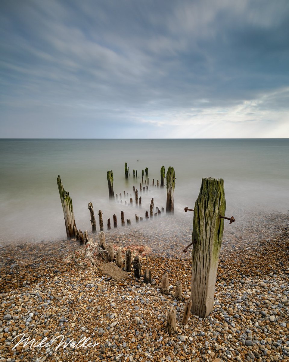 Who knows the theory behind this series of wooden posts? I think a few tots of rum were had when they were putting them in! Taken at the end of the Rye Harbour Estuary in East Sussex. <a href="/visiteastsussex/">Visit East Sussex</a> <a href="/VisitSussex/">VisitSussex</a> <a href="/BBCSussex/">BBC Sussex</a> <a href="/sussexcoastcrew/">SUSSEX COAST CREW</a> <a href="/ryesussex/">Rye, East Sussex</a> <a href="/ryeharbour_NR/">Rye Harbour Nature Reserve</a>