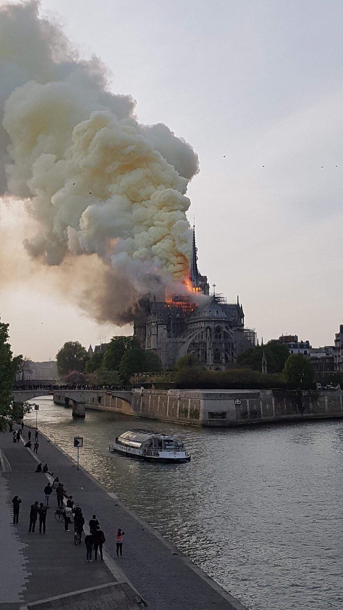 SkylineArch's tweet photo. How painful! Notre Dame Cathedral, in France, burning down. It was built in 1163 and is one of the oldest buildings in the Gothic style. The images that we're seeing are terrible. https://t.co/TKBC6wS5Xu