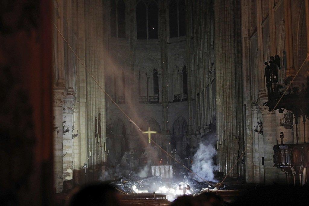 KacieMcDonnell's tweet photo. Image of #NotreDame's interior now. Not lost. I have chills...notice the cross. How can't you? 

(via Reuters' Philippe Wojazer) https://t.co/sNkzdBNLkd