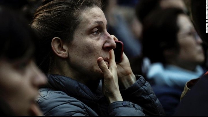 elisablet's tweet photo. just look at their faces... their hearts were broken by a fire which destroys notre dame. i'm crying when i see this. i feel so sorry for french citizens. they lost their great history in four hours... 
#NotreDame https://t.co/TemxjcjWVk