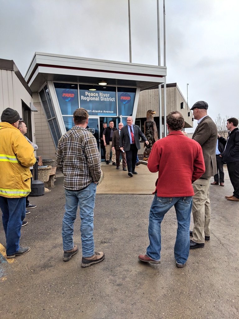 Tay_K_MacIntyre's tweet photo. Group waits patiently for Premier Horgan to leave meetings at the @PeaceRiverRD. Head to our Facebook page to rewatch the live media availability and don't miss the highlights tonight at 6pm on @cjdctv. https://t.co/xQh9cZymSZ