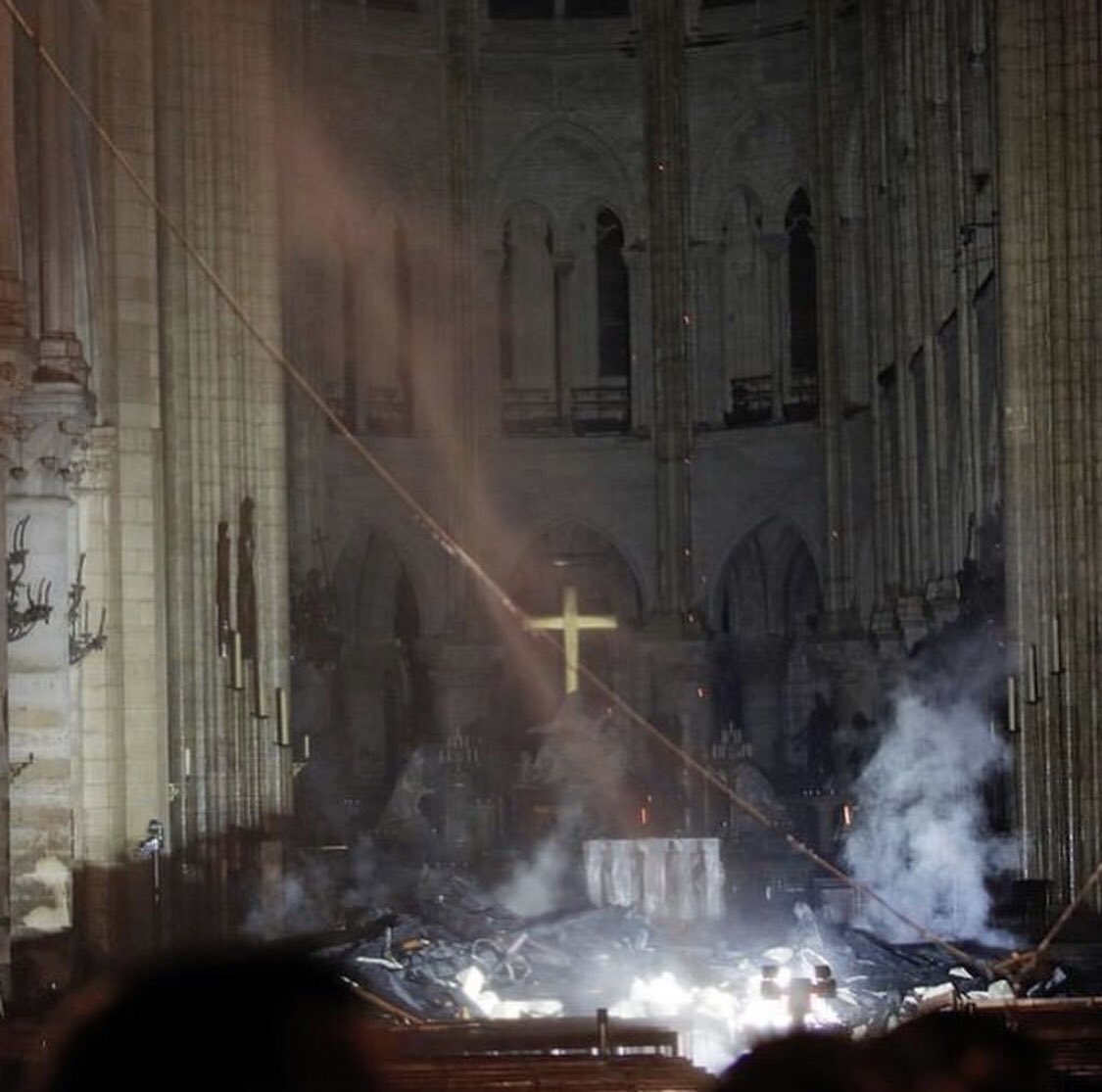 Chipped_Diamond's tweet photo. A devastating fire may have gutted Notre Dame in Paris — but amid the smoke and ash, the cathedral’s altar and cross are still intact. The blaze raged for several hours on Monday evening before 400 firefighters managed to bring it under control. From @CNN https://t.co/tbxRtHes4k