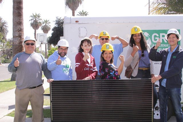 Senator Hurtado poses with Tesla and GRID staff and the Garcia family before the solar installation on their home.