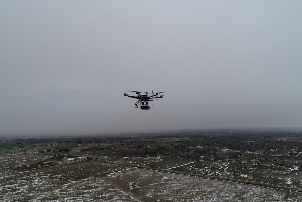 ResearchCSU's tweet photo. Gray skies did not deter the POPS Senior Design Team from flying their partical air sampler above Fort Collins on Friday. The team has partnered with the CSU Drone Center to research smoke in the atmosphere. #RamResearch https://t.co/xF78BMTZWe