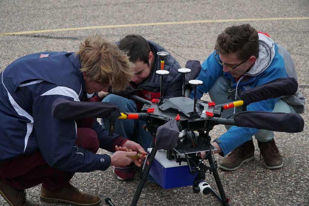 ResearchCSU's tweet photo. Gray skies did not deter the POPS Senior Design Team from flying their partical air sampler above Fort Collins on Friday. The team has partnered with the CSU Drone Center to research smoke in the atmosphere. #RamResearch https://t.co/xF78BMTZWe