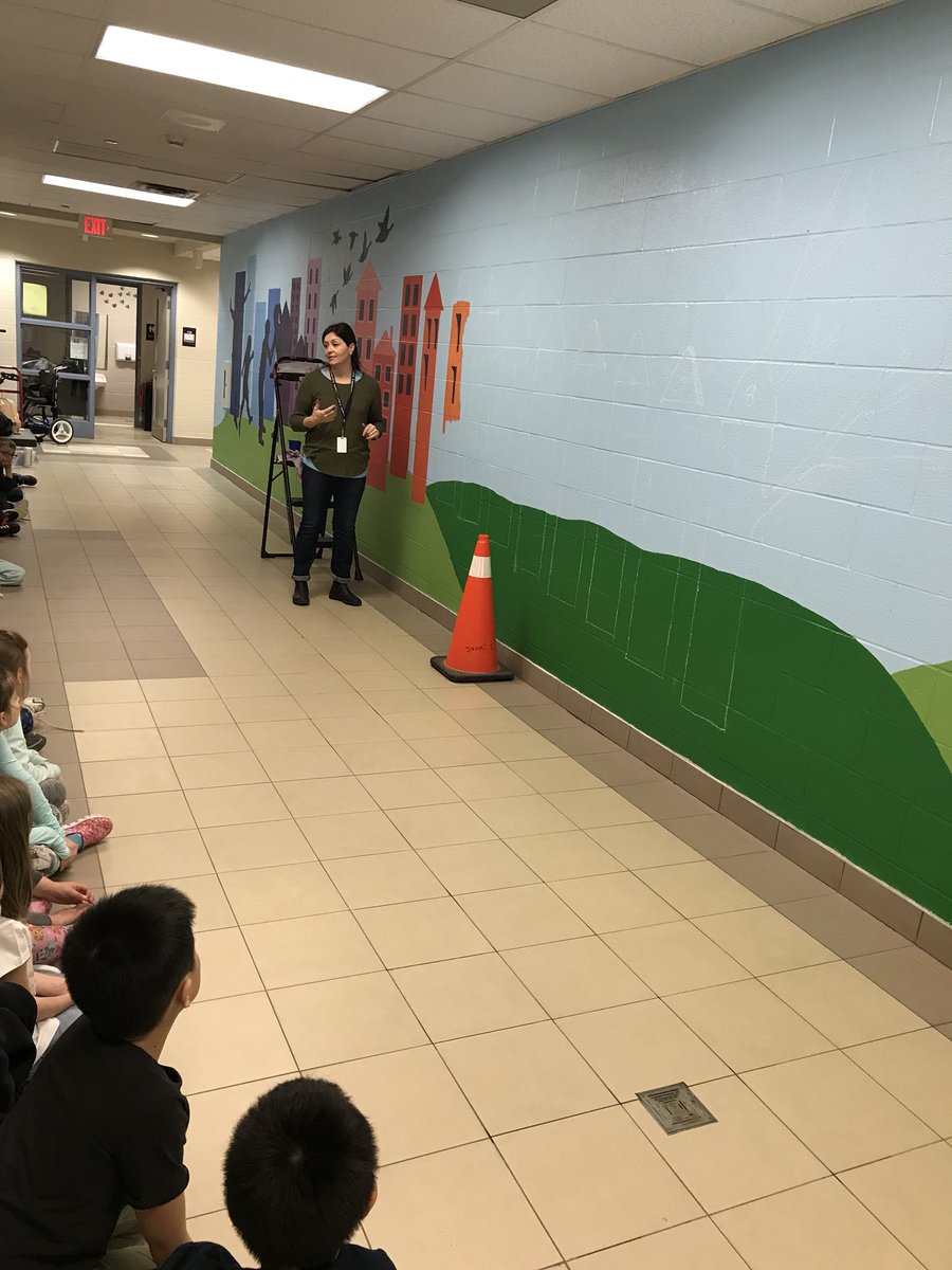 2C had a chance to meet the artist who has started our school mural. We get to add to it later in April!