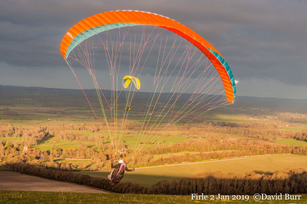 RAFHangPara's tweet photo. A lovely set of photos by @Bur1Burr of RAFHPA paraglider Pilot @FltMonkey (@RAFWaddington) from earlier this year at Firle Beacon. Staying current during the winter months is important for any paraglider pilot to prevent skill fade and maintain good airmanship #flysafeflyhigh https://t.co/Kmp7ZYyKsA
