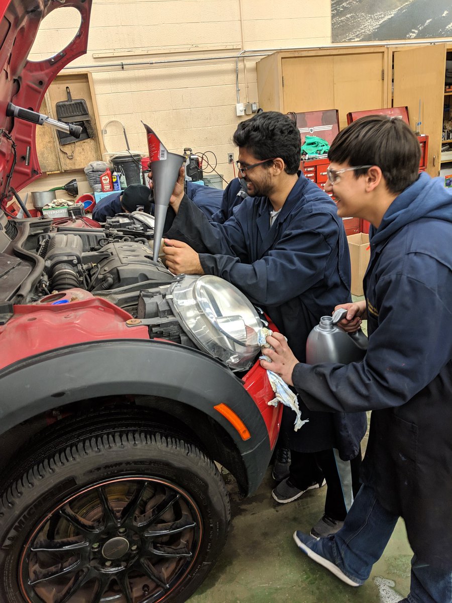 MsJLee12's tweet photo. Rosie the mini Cooper in the #TFSSautoshop getting her oil changed by our Grade 11 Transportation students @SHSMPeel #TFSSfam #SHSMtransportation #teamwork #havingfunlearning https://t.co/gkx7Bc2kZH