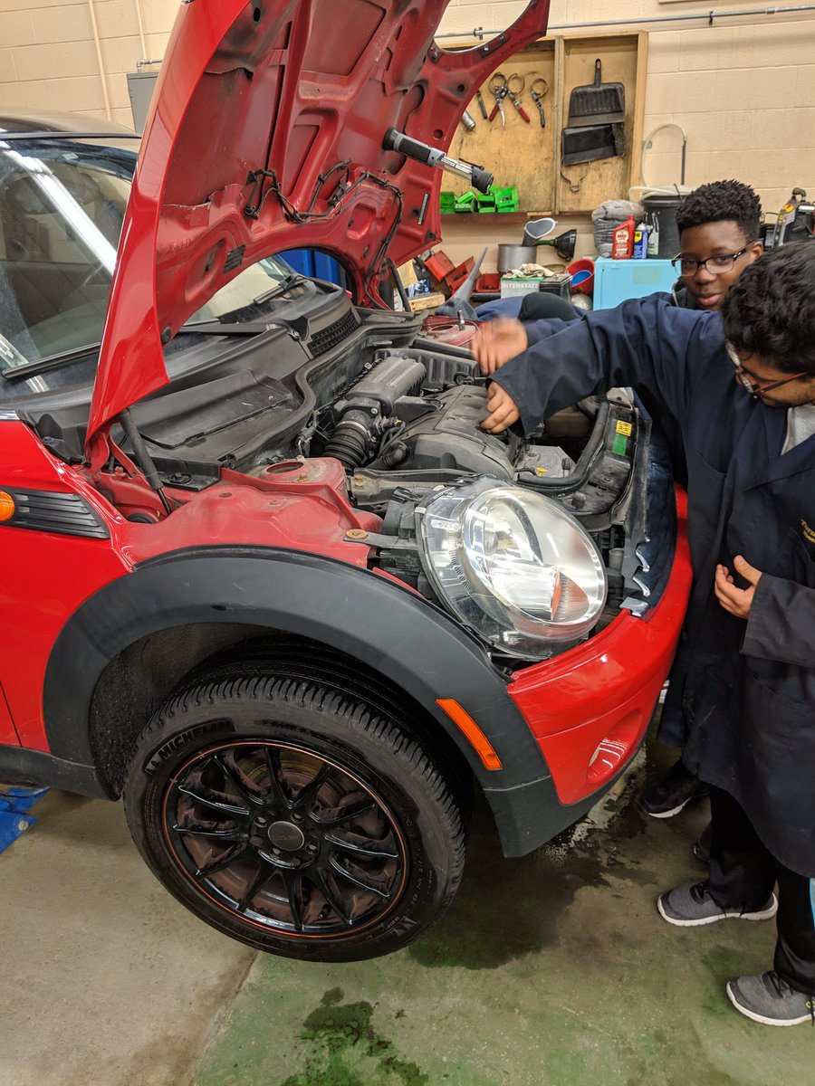 MsJLee12's tweet photo. Rosie the mini Cooper in the #TFSSautoshop getting her oil changed by our Grade 11 Transportation students @SHSMPeel #TFSSfam #SHSMtransportation #teamwork #havingfunlearning https://t.co/gkx7Bc2kZH