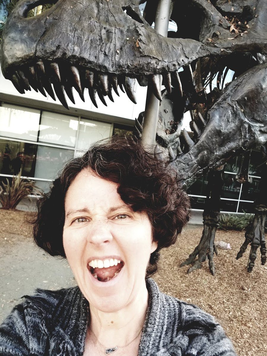 Me in front of the Google t-rex skeleton sculpture