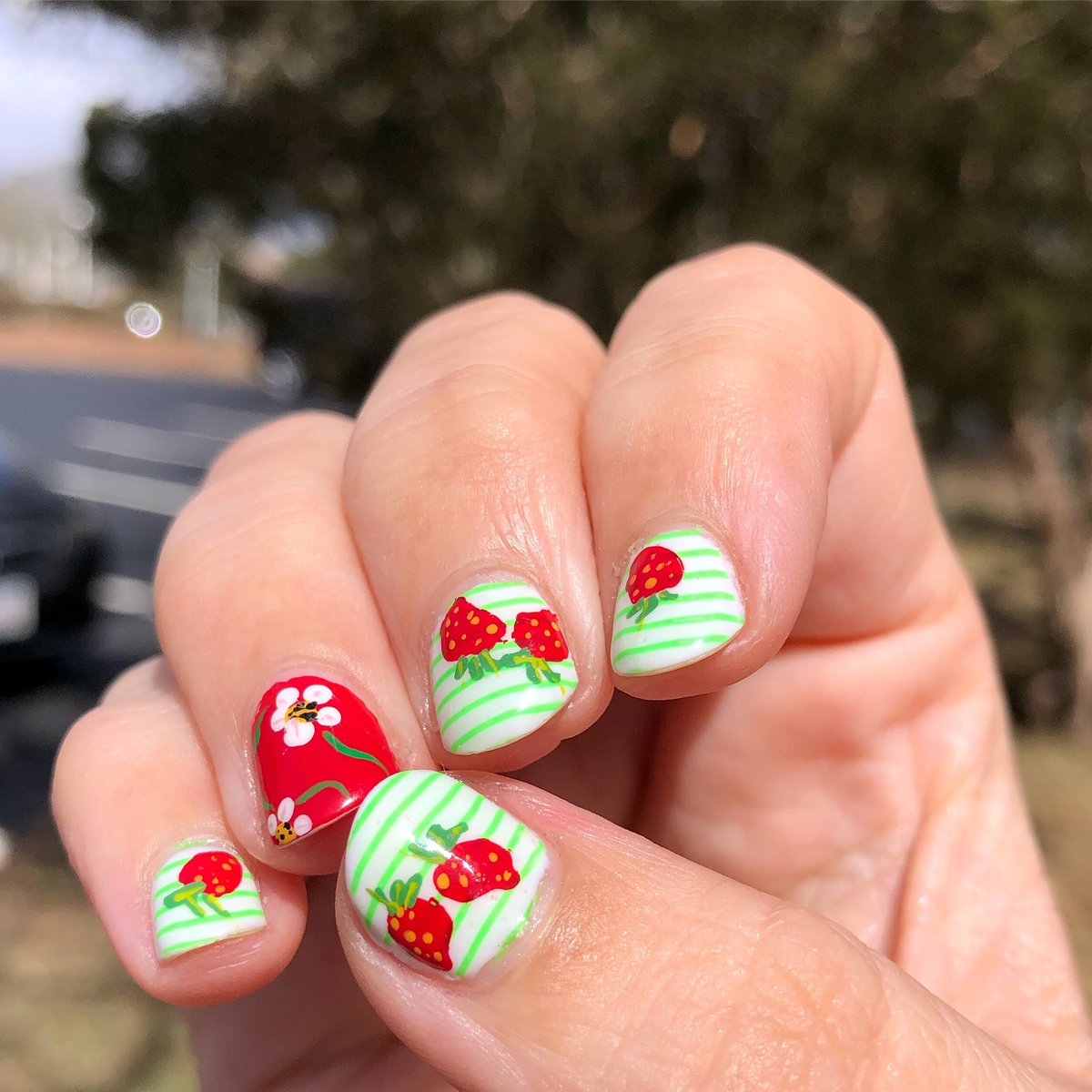 londonbrolly's tweet photo. Strawberry 🍓 and striped manicure on a base of @OPI_PRODUCTS Funny Bunny 🐰 with a strawberry blossom 🌸 accent nail on @OPI_PRODUCTS Red My Fortune Cookie💅🏻
.

#fruitnails #strawberrynails #stripednails #springnails https://t.co/P25jyxlgMZ