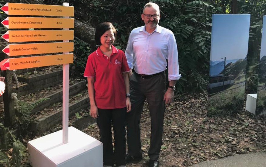 SwissAmbSGP's tweet photo. It's #hiking time of #SwissWeek19🥾 Had the pleasure to welcome Ms Sim Ann, Senior Minister of State, @SingaporeMCI, to join me on the #Swiss-#Singapore friendship hike at #BukitTimahNatureReserve🇨🇭⛰️🇸🇬 Thank you @MySwitzerland_e and @nparksbuzz for this great event! #planitswiss https://t.co/5EypeskKpJ