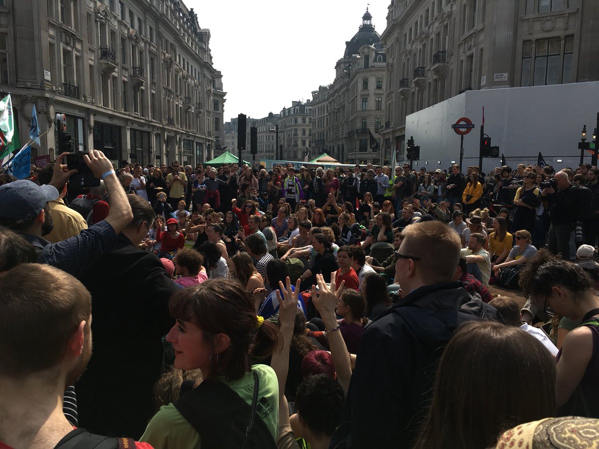 ExtinctionR's tweet photo. Amazingly, we have resisted arrest in Oxford Circus and are now holding an assembly on the very important question of international solidarity and decolonisation.

Pleased we fought for the space to have this discussion. Look at the crowds!

#InternationalRebellion https://t.co/CqLJhVkTxY