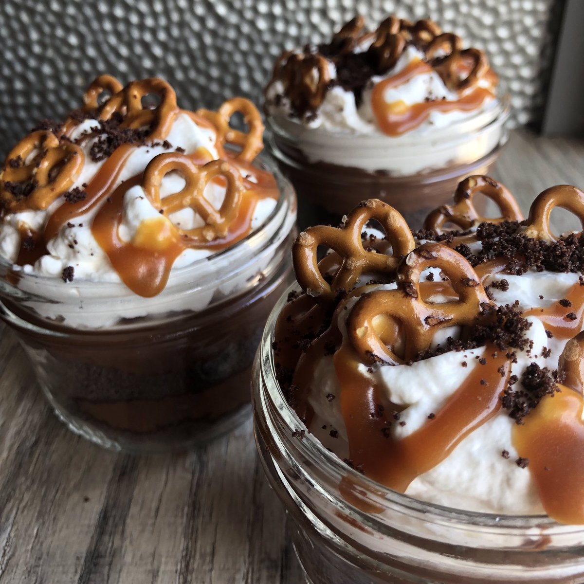 YUP- dirt cup. Homemade chocolate pudding, gluten free chocolate cookie crumbs, caramel sauce, whipped cream, and baby pretzels! #omg 🔥🔥🔥