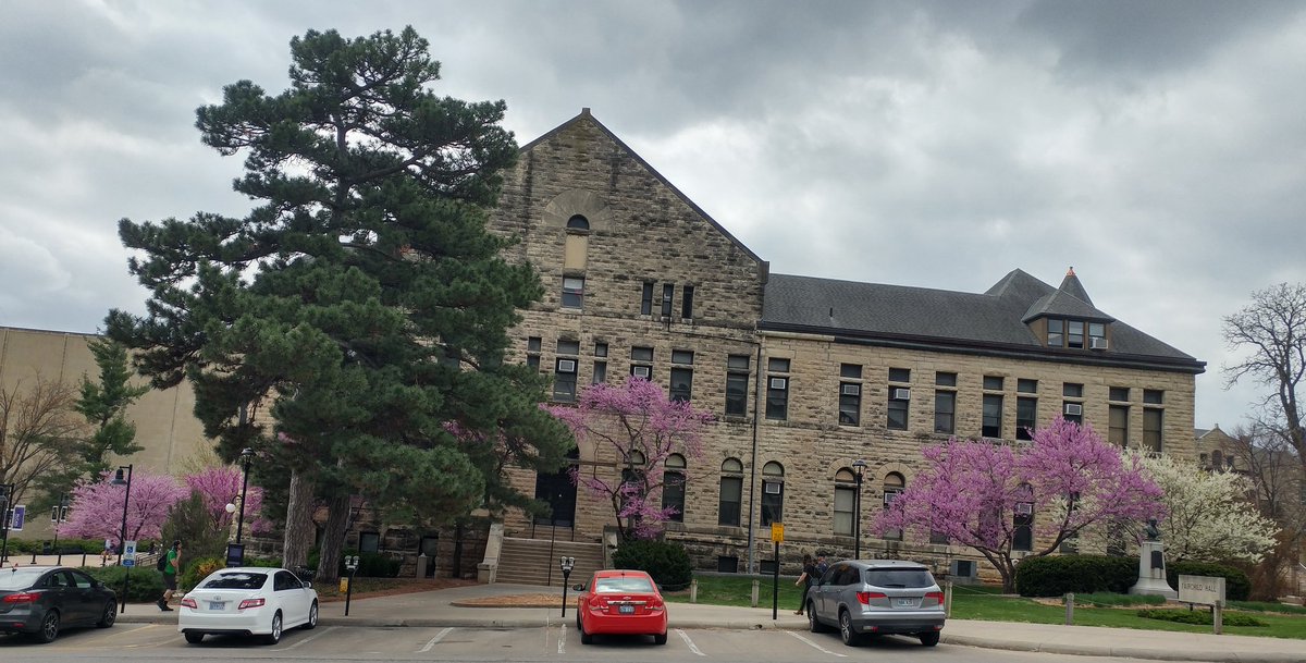 BethMontelone's tweet photo. Such a beautiful time of year on the @KState campus. The redbuds against the limestone buildings are iconic images for a reason. https://t.co/PVfMSkkRrO
