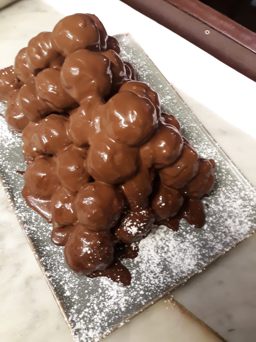 Profiteroles cake at friendsofflavours.london. #italianfood #italian #restaurant #london #londonrestaurant