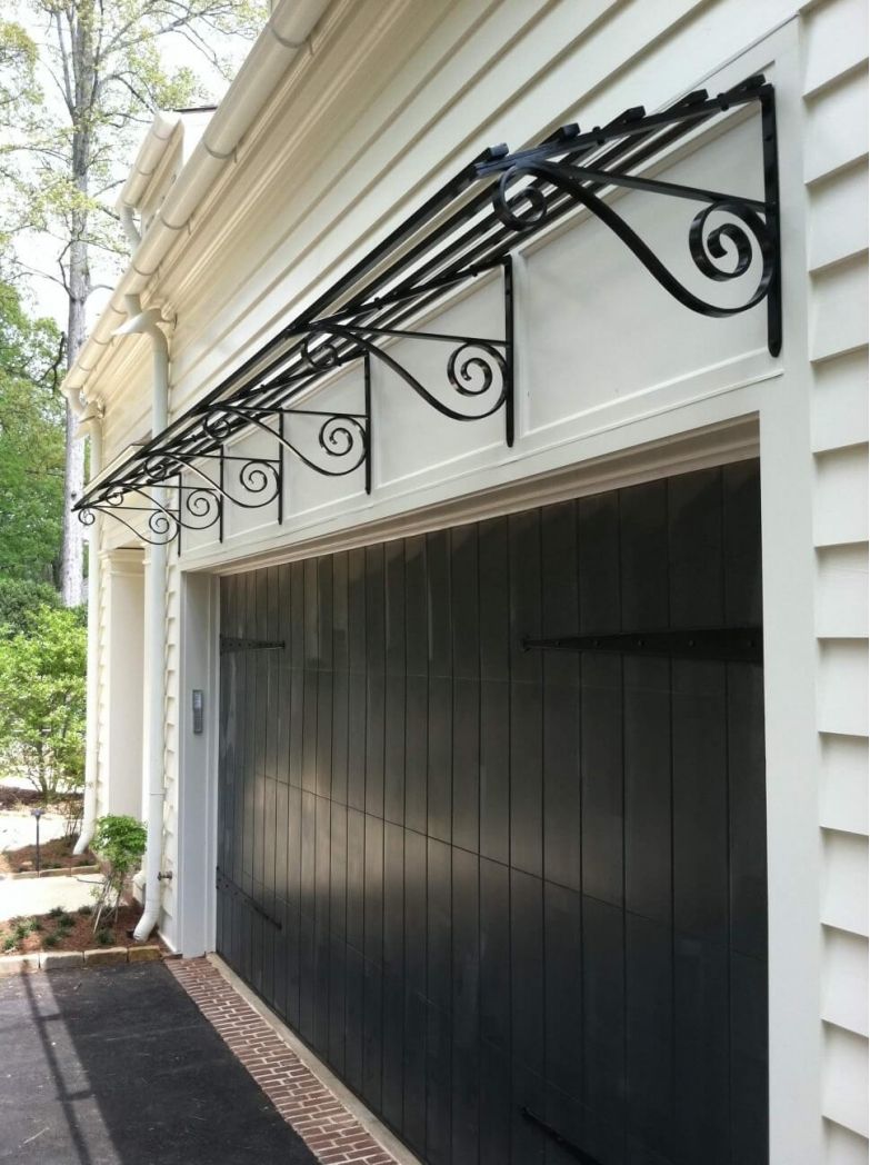 Modern Designed Iron Arbor over Garage
See more here: buff.ly/2I90kLu  #IronWork #IronArbor #GarageDesign #HGDesignIdeas