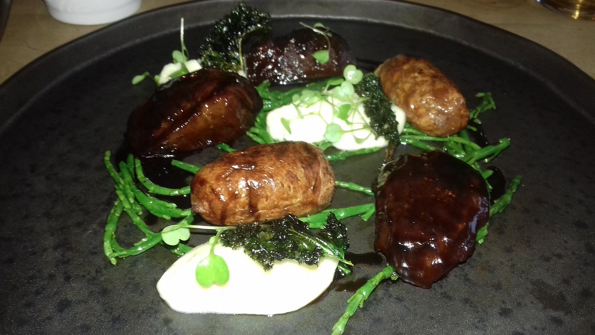 Superb braised pork cheek served with lamb & onion sausage, creamed celeriac and samphire @thehandhotel #llanarmon