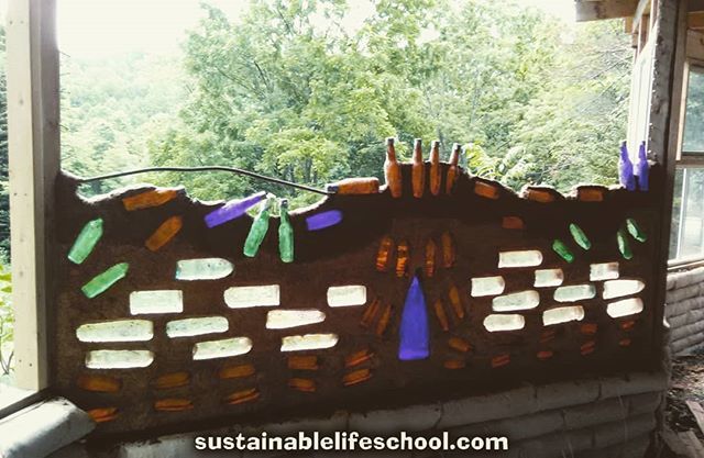 SusLifeSchool's tweet photo. A pic from when we were building the #bottlewall. You can see the piece of bent rebar that we put in the middle of the wall for stability. This wall faces West and lets diffuse light in without much heat in the Summer.

Follow us @sustainablelifeschool for more on:

#earthba… https://t.co/FaqIYWlpry