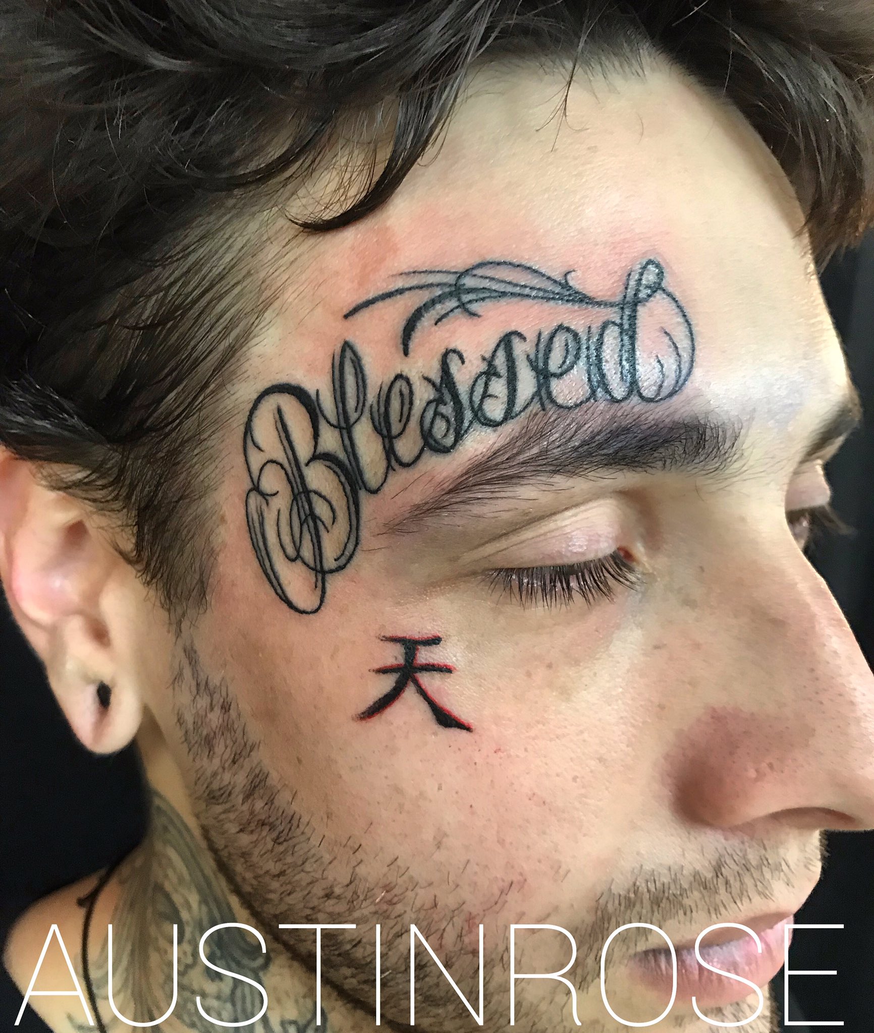 Blessed lettering tattoo on Travis Barkers face