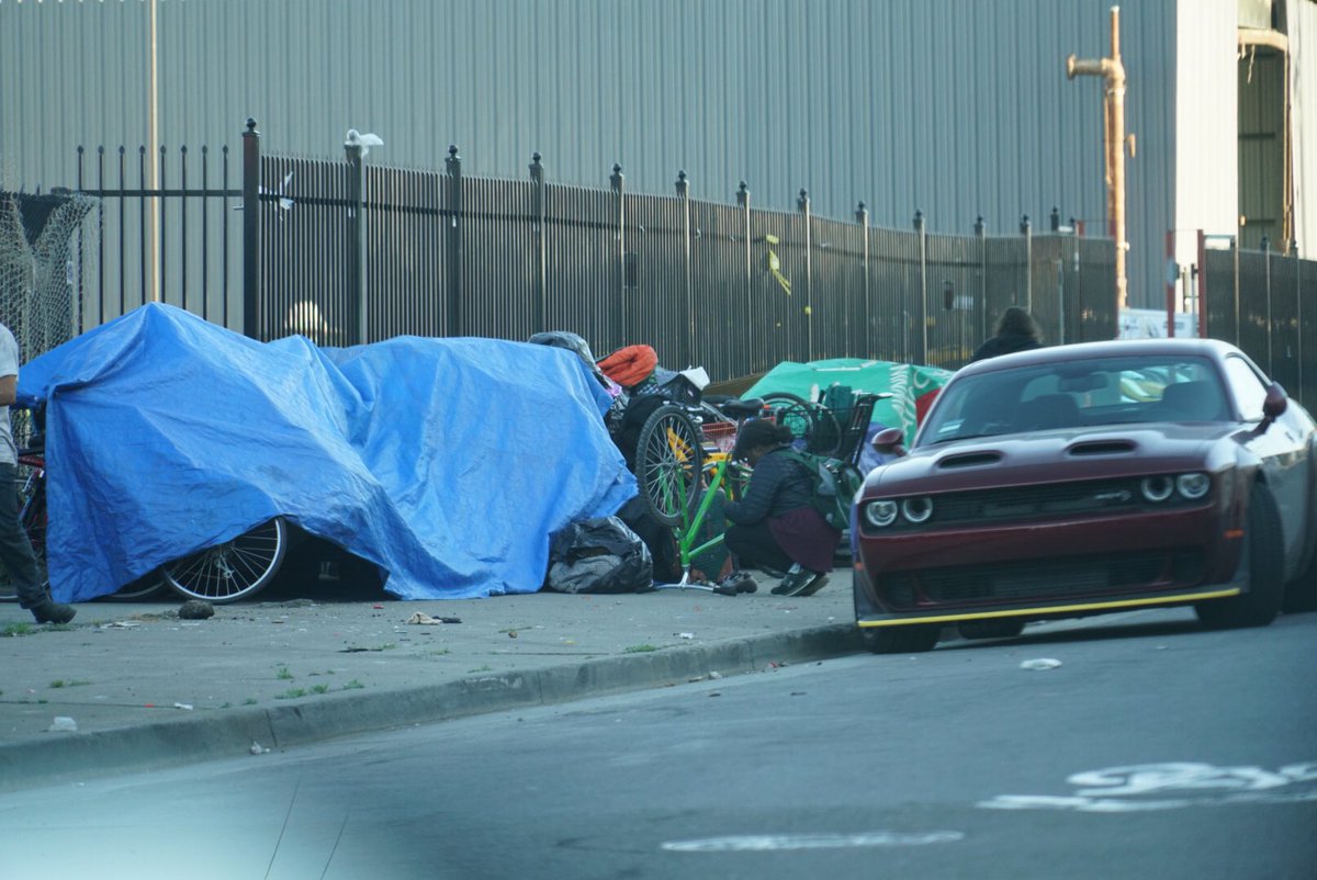 SFbikebandits's tweet photo. Huge chop shop behind Lowe’s on Loomis st. Probably a dozen stolen bikes hidden under this tarp. Come find your bike here if it was stolen in Mission or Soma!! @stolenbikessfo @SFPD watch out the guy has nunchucks!!! 🧟‍♂️ https://t.co/iLwokvq3nh