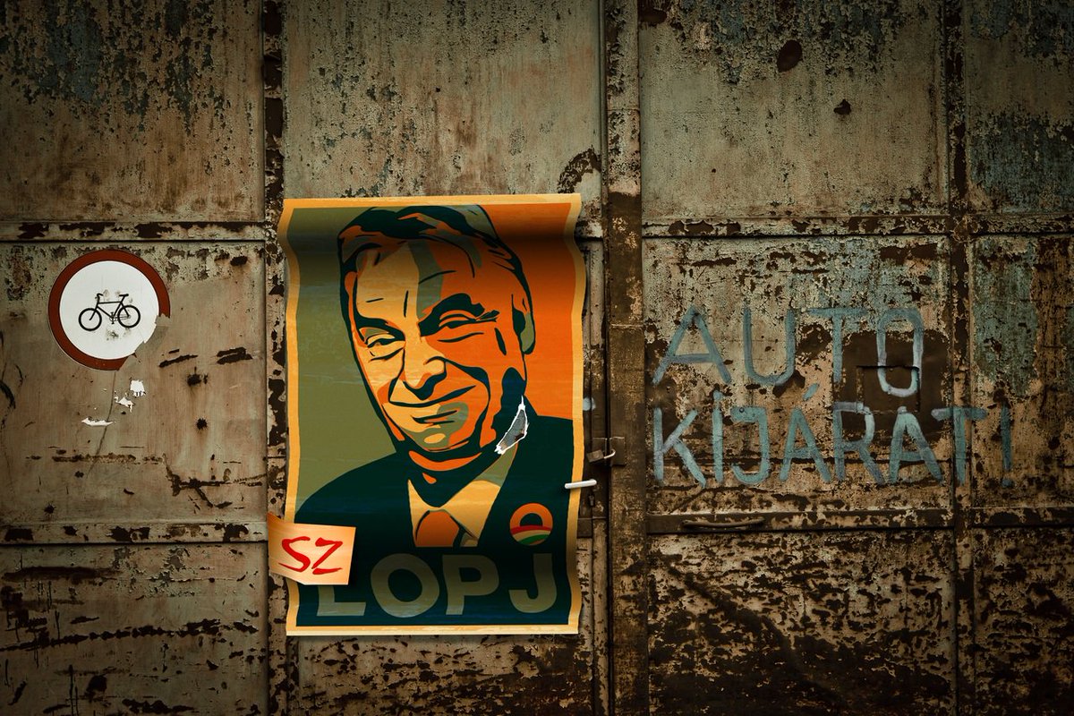 Garage door in Hungary with a poster criticising PM Orbàn