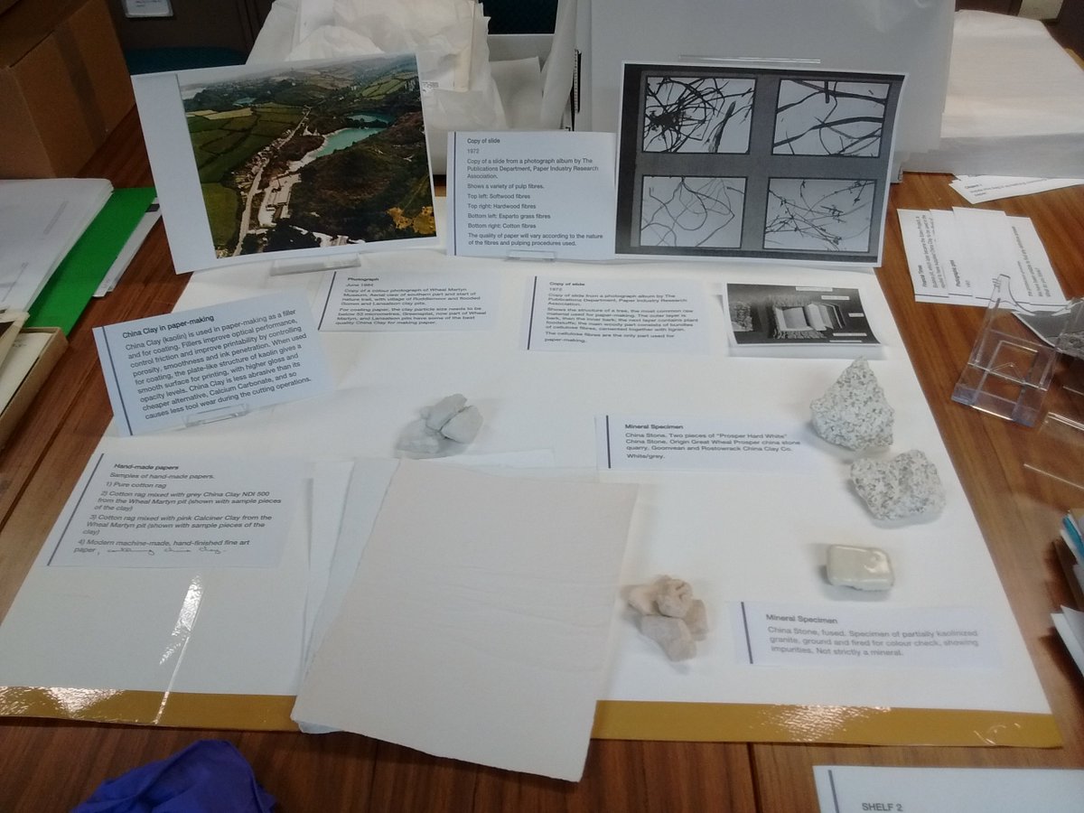 WhealMartyn's tweet photo. Before the objects were put in the cabinets, we had to work out where they would go first. Here's Carol working out how her papermaking display would look using paper templates. #CitizenCurators #EngineeringTheEarth #StAwesome https://t.co/Bt86AIuqwi