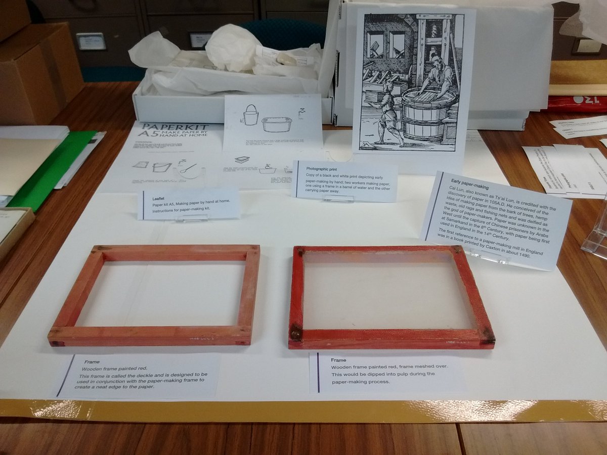 WhealMartyn's tweet photo. Before the objects were put in the cabinets, we had to work out where they would go first. Here's Carol working out how her papermaking display would look using paper templates. #CitizenCurators #EngineeringTheEarth #StAwesome https://t.co/Bt86AIuqwi