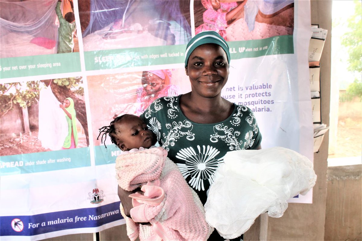 Nigerian mother with malaria netting