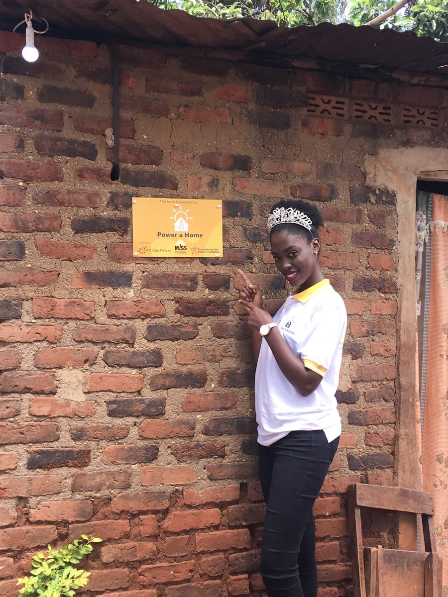 MaadMcCann's tweet photo. Miss Uganda 2016, @leah_kagasa, beaming in happiness as she stands in front of a house that’s also a beneficiary of the #PowerAHome initiative in Bukoli C, Mayuge District.

#LightUpMayuge https://t.co/gyS0tDTeYl