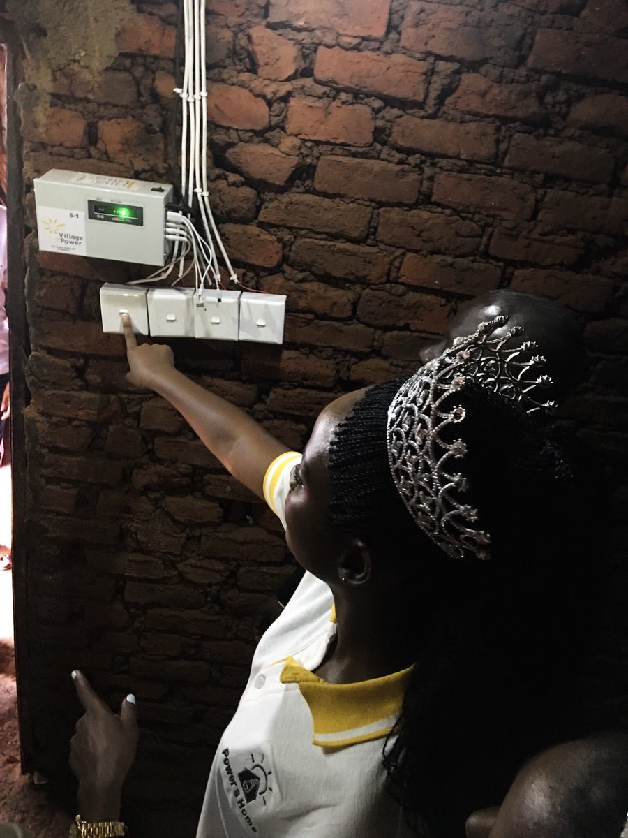 MaadMcCann's tweet photo. Miss Uganda, @QuiinAbenakyo presses the switch to literally #LightUpMayuge as she kickstarts the #PowerAHome initiative in her home area. The campaign will stretch across the country with a goal to bring solar to 10,000 homes in Uganda. https://t.co/T8ZkF4Jdlm